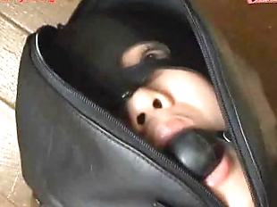 Ballgagged asian girl tied into a leather..
